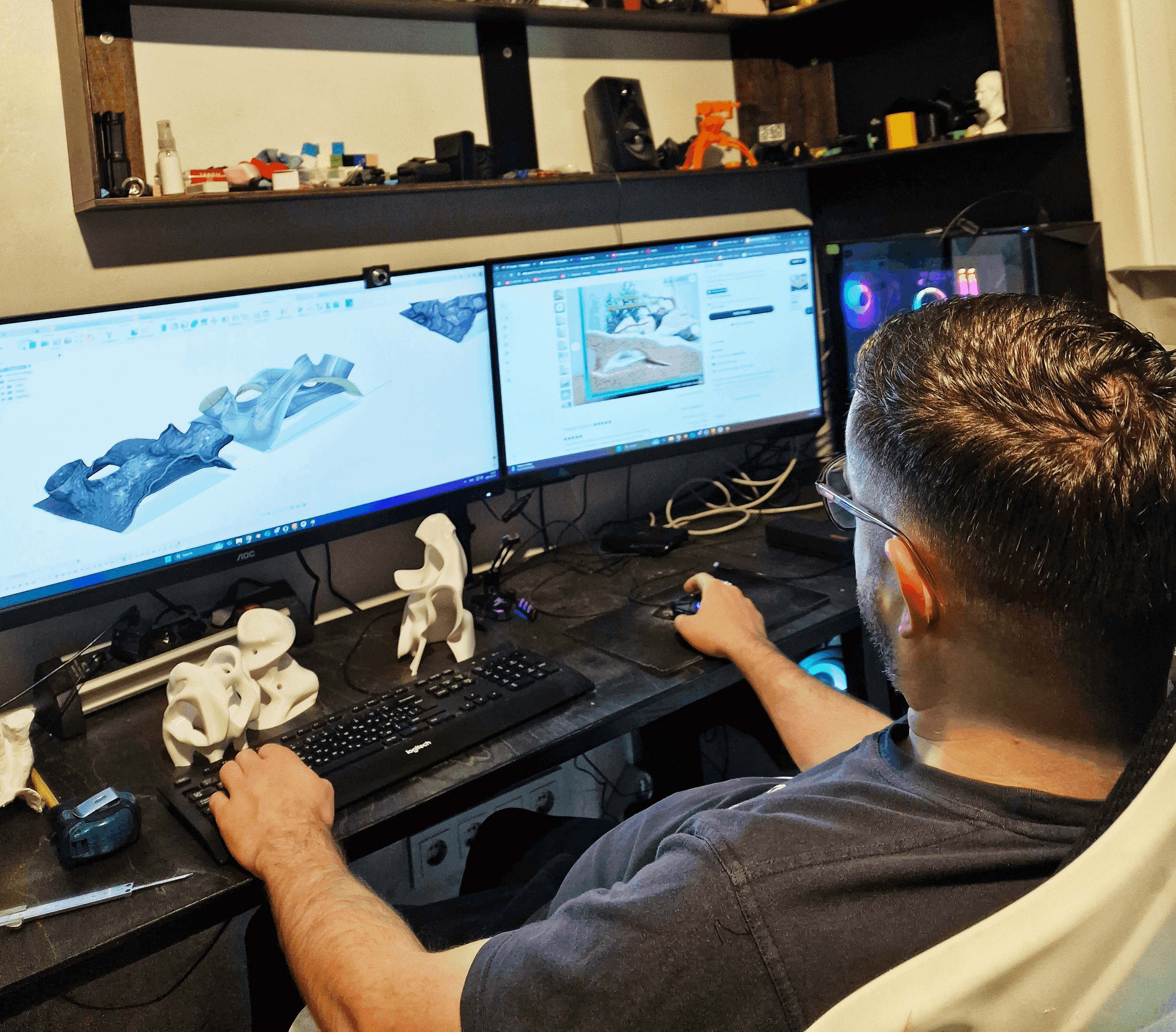 A designer creating and printing custom aquarium accessories using 3D modeling software on dual monitors. The workspace features 3D-printed fish tank decor prototypes, demonstrating the process of designing and printing custom aquarium accessories. Ideal for aquarium hobbyists and 3D printing enthusiasts looking to personalize their fish tanks with unique, functional decor.