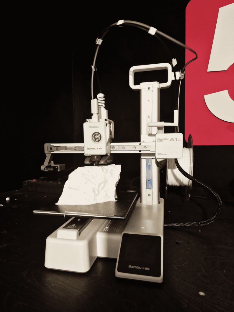 Bambu Lab A1 Mini in action, illustrating a 3D printer guide for beginners who want reliable PLA and PETG prints.