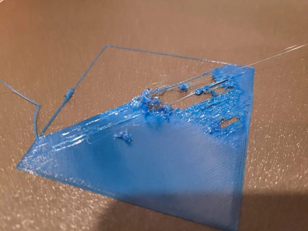 one of petg printing problem - bed adhesion showcased as the fialment sticks to the print bed