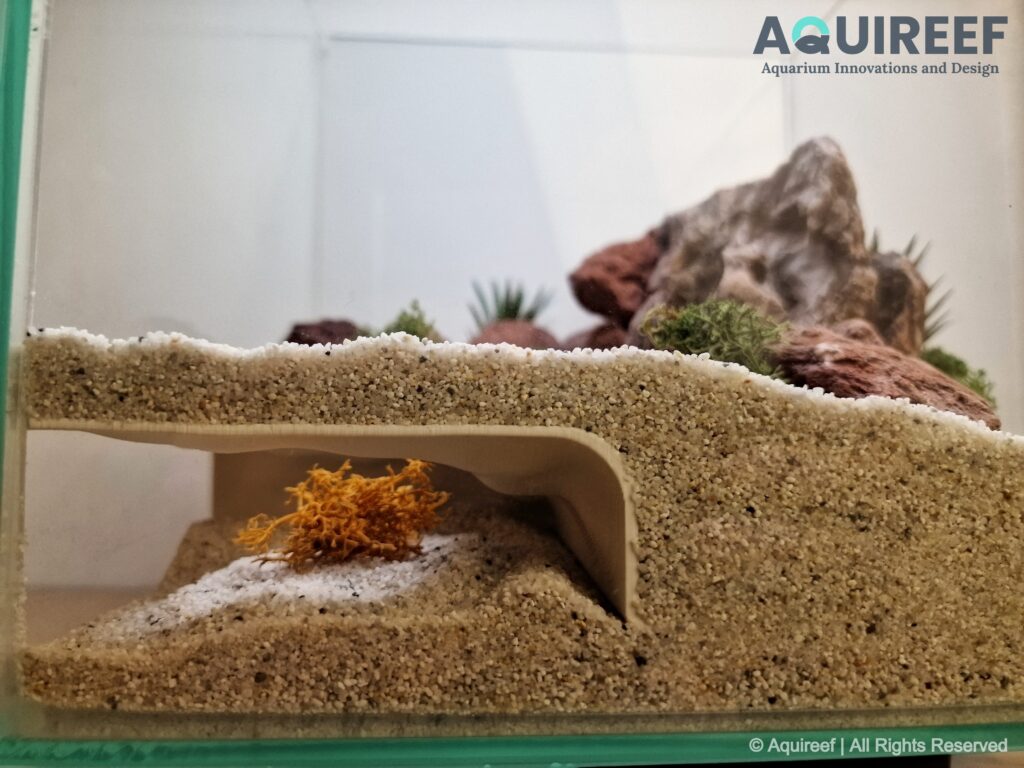 A side view of the volcanic corner cave designed for cichlids and similar fish species by Aquireef3D.